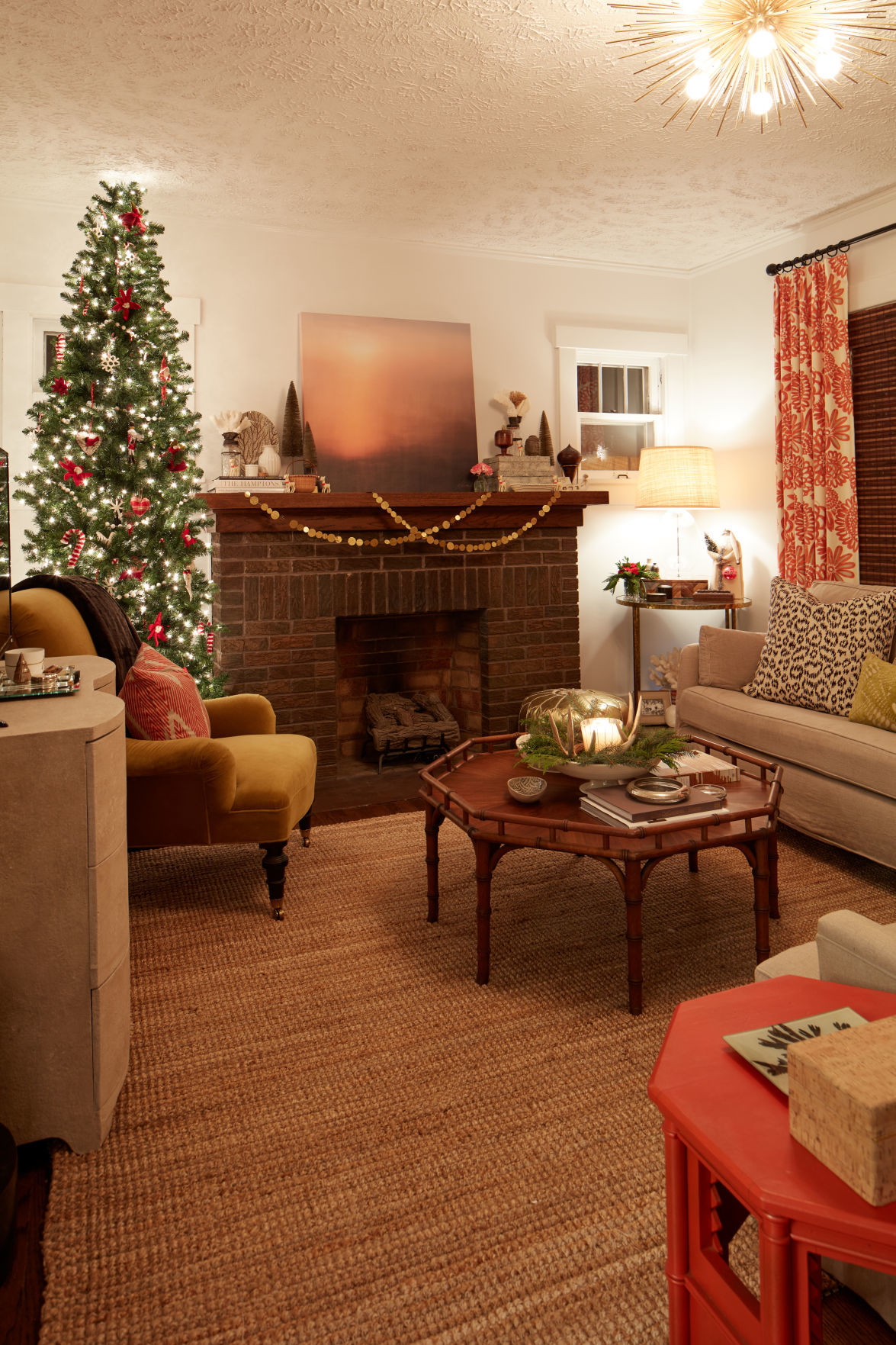 Amy puts her big tree in the living room.